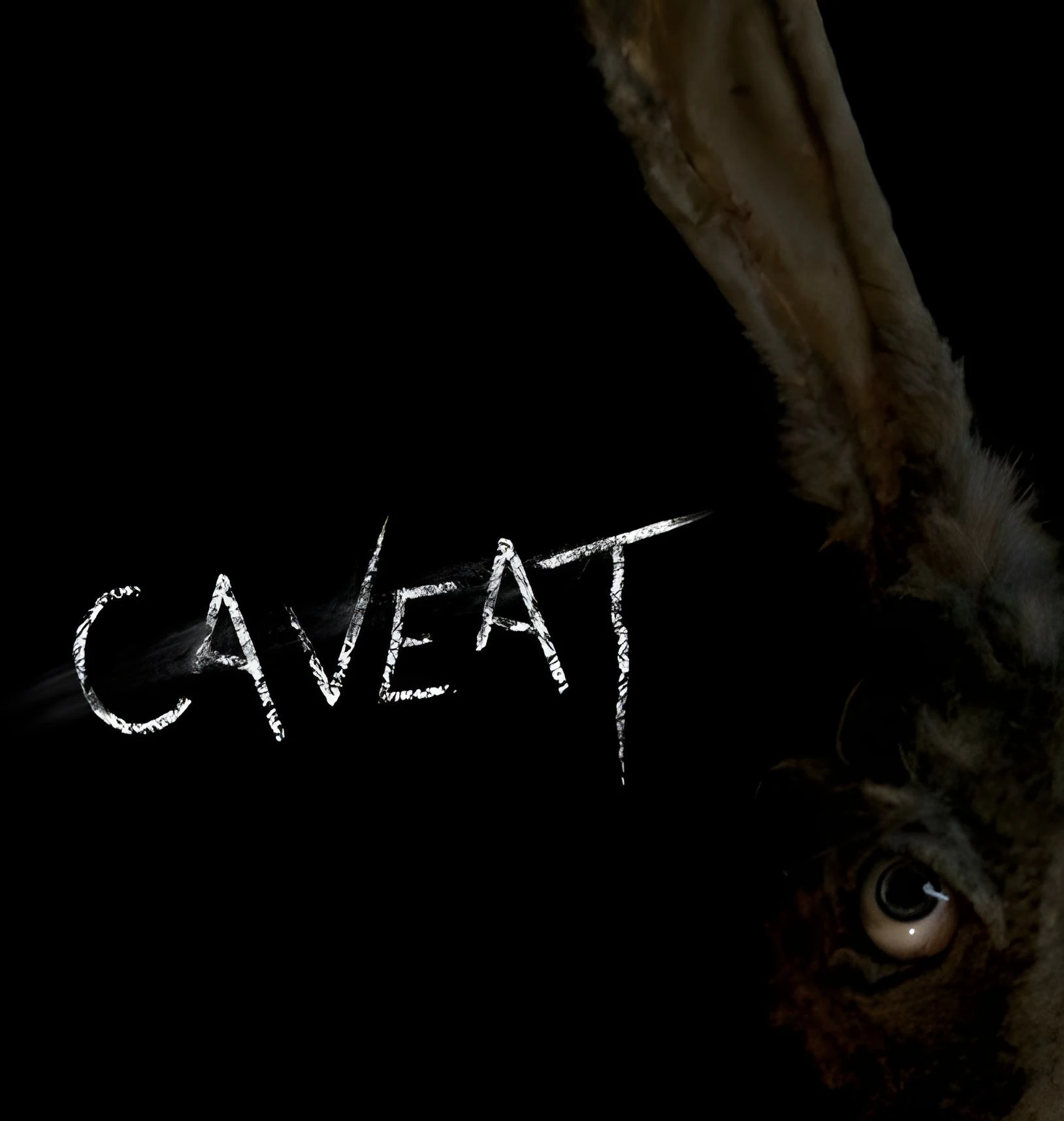 Before Oddity, there was Caveat. We review Damian Mc Carthy's creepy 2020 debut. Is this slow-burn Irish horror worth your time? Find out here.