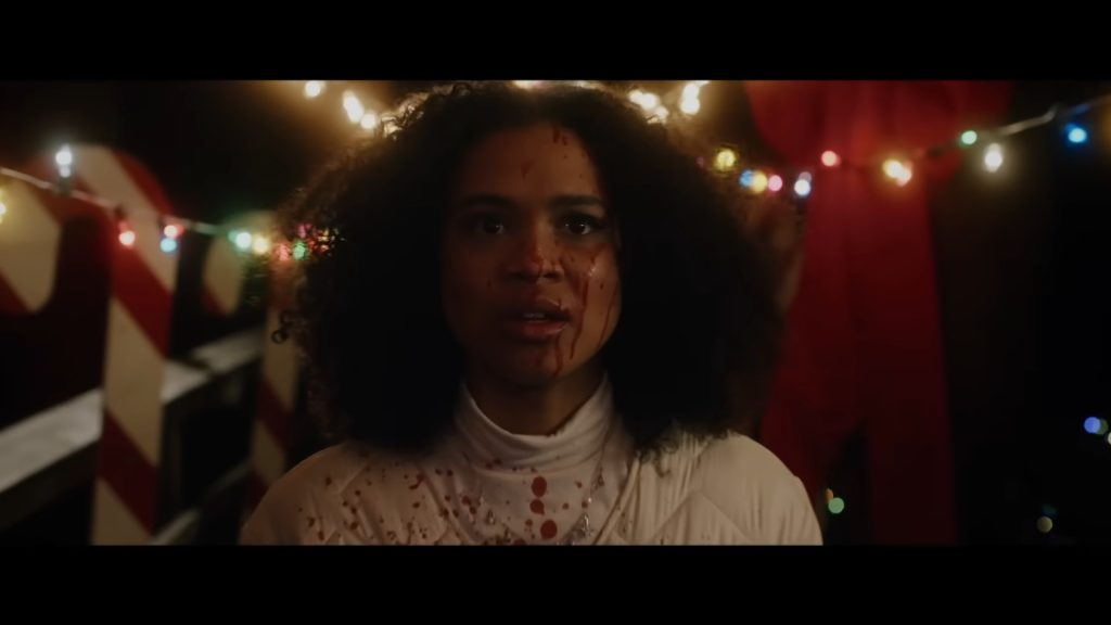 A screenshot from Shudder Original Christmas horror It's a Wonderful Knife (2023)