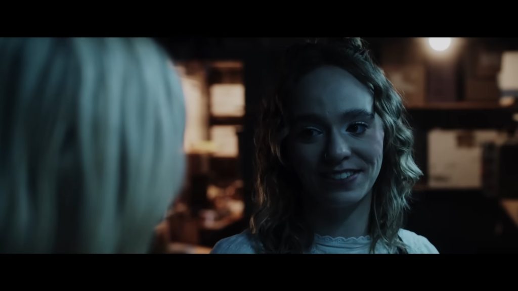 A screenshot from Shudder Original Christmas horror It's a Wonderful Knife (2023)