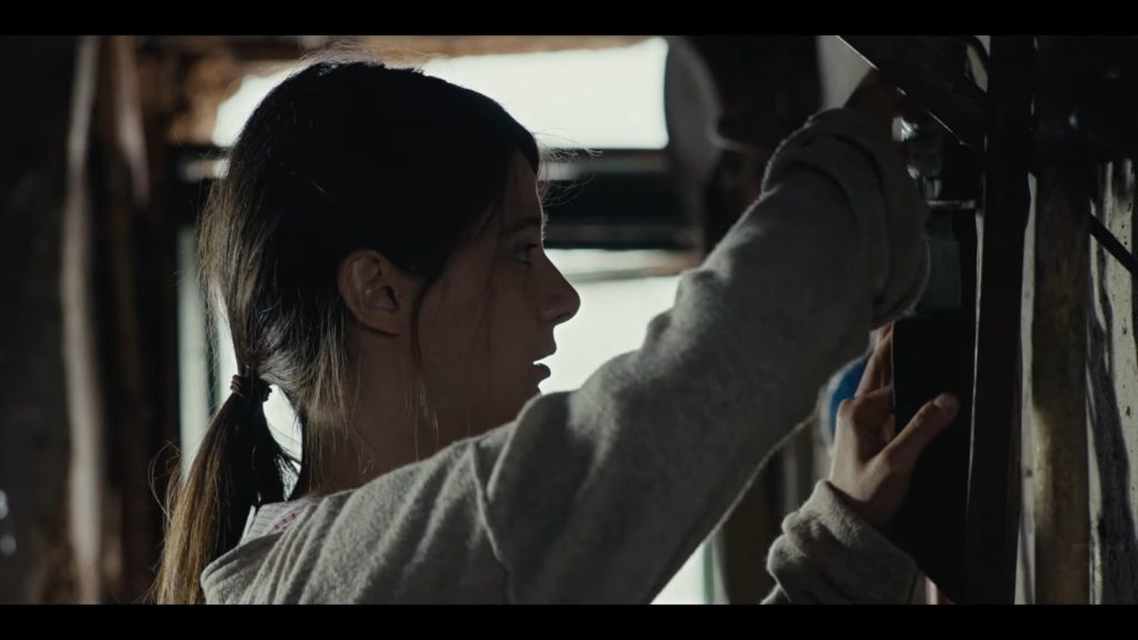 A screenshot from horror movie Mudbrick (2023)