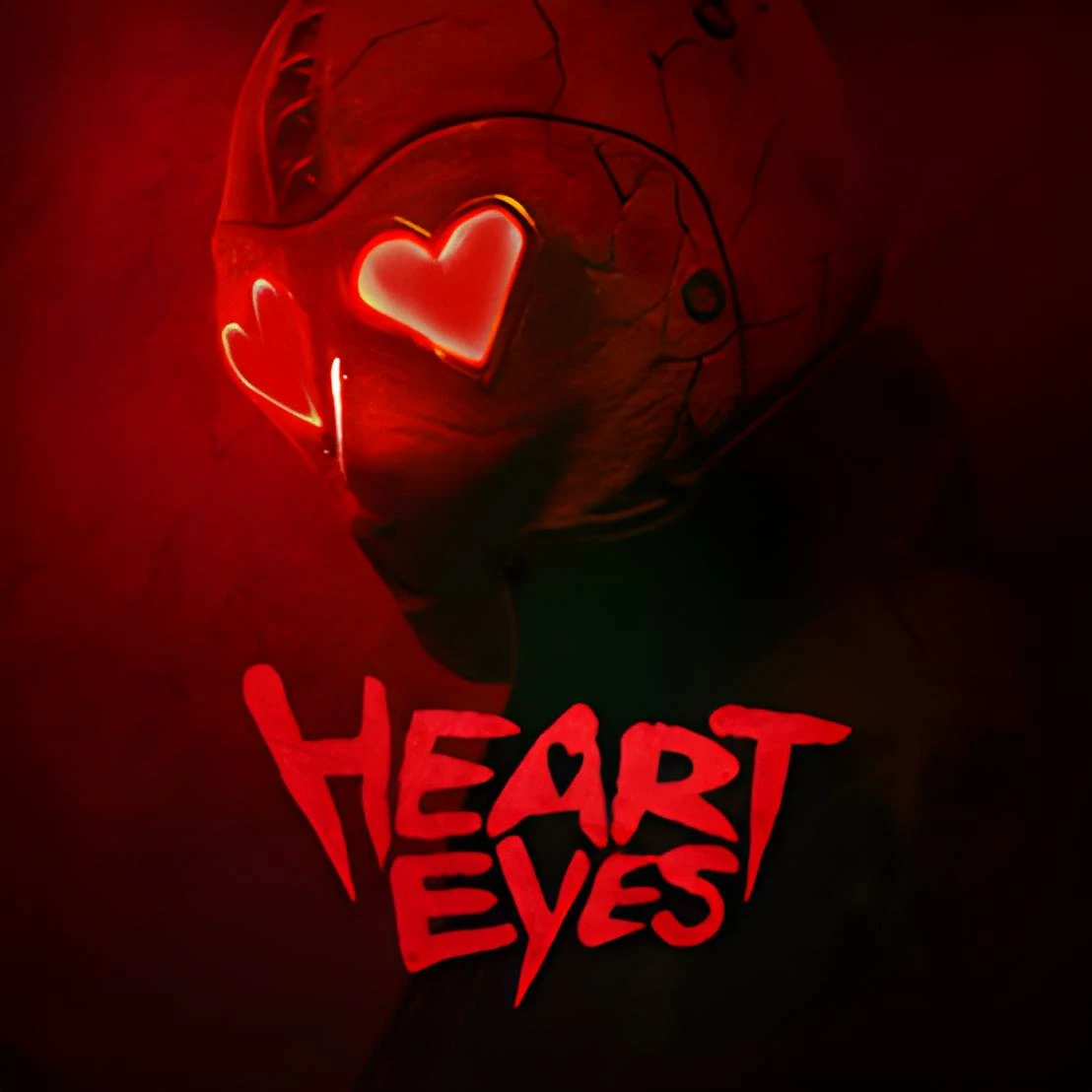 A movie poster for "Heart Eyes." The image shows a masked figure wearing a red, possibly metallic, helmet or mask with large, glowing heart-shaped eyes. The background is a dark, shadowy red. The title "HEART EYES" is written in a jagged, blood-red font at the bottom. The mask has cracks and visible seams, giving it a worn and sinister appearance.