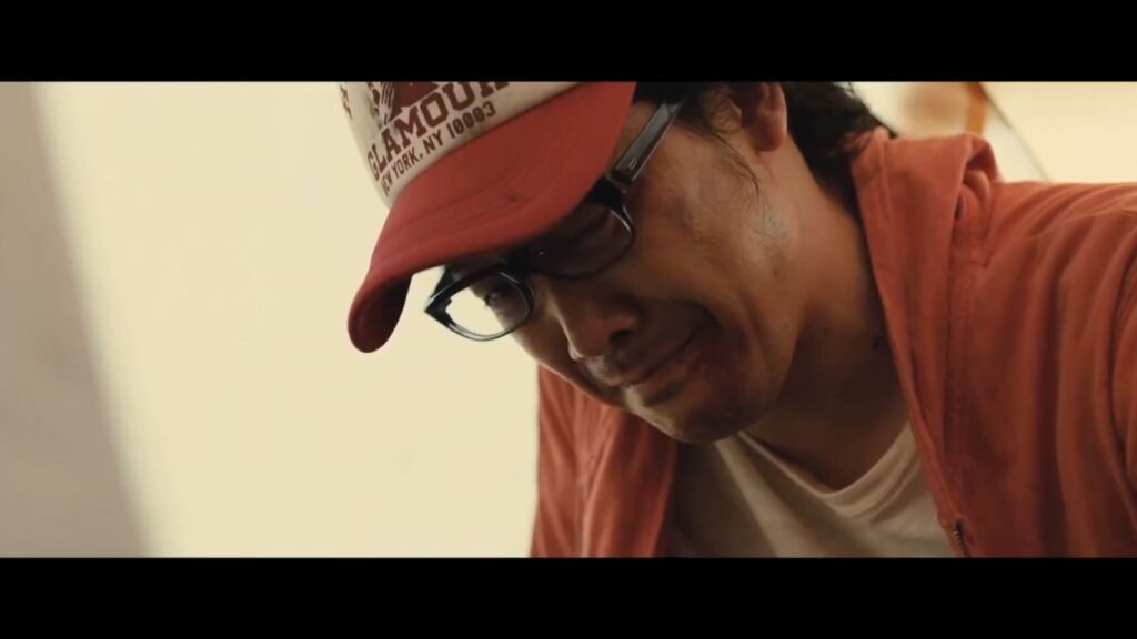 A screenshot from J-Horror zombie comedy movie I Am a Hero (2015)