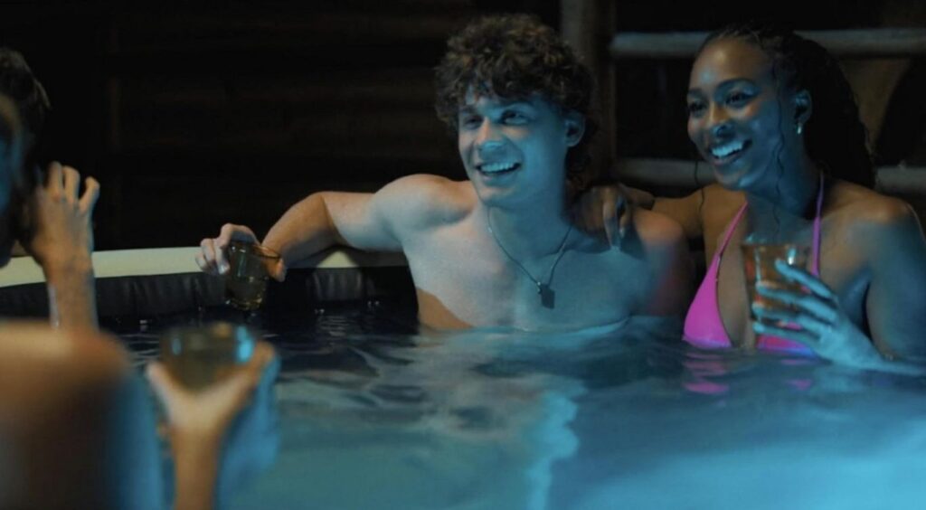 A screenshot from influencer themed, cabin in the woods, Tubi horror movie Glamping (2025)