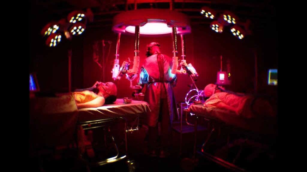 A wide shot of a high-tech, eerie medical lab bathed in red light, showing Dr. Kezian (Djimon Hounsou) standing between two patients on operating tables.