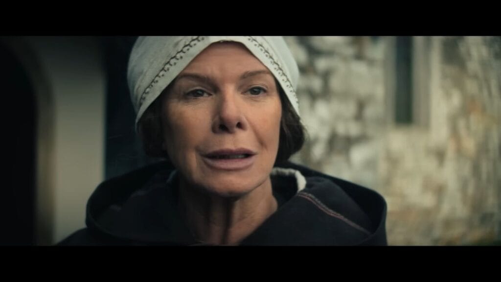 Close-up of Morwen (Marcia Gay Harden) wearing a medieval head covering in The Dreadful.