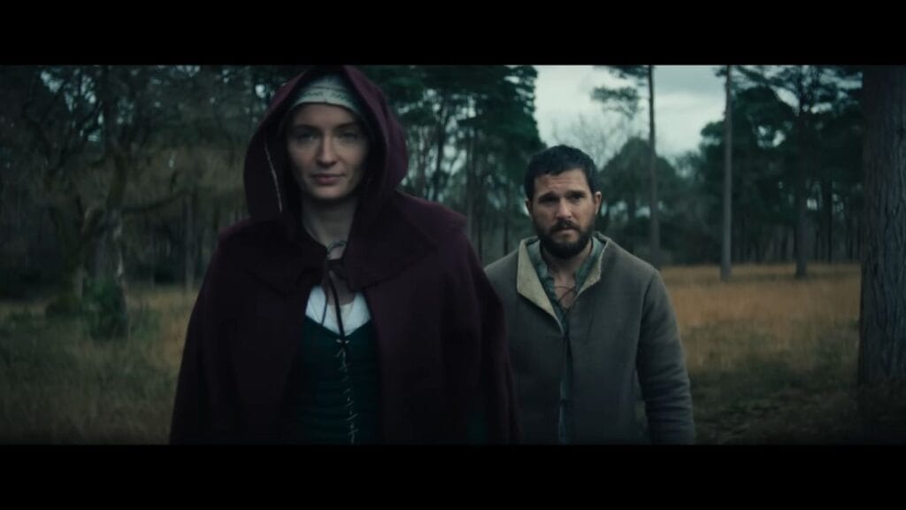 Anne (Sophie Turner) and Jago (Kit Harington) walking through the woods in a scene from The Dreadful.