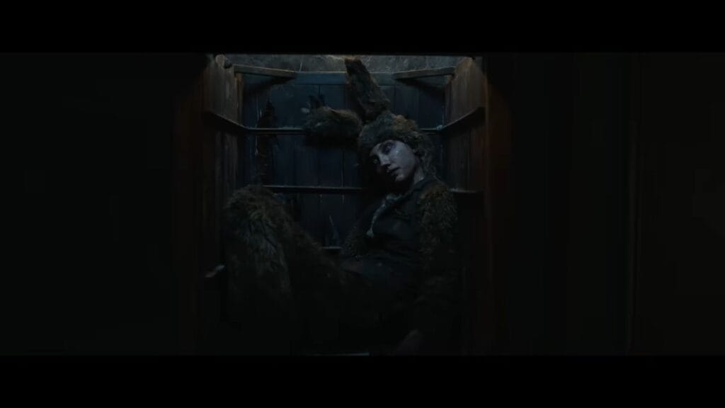 The body of Fiona in a rabbit costume discovered inside a wooden dumbwaiter.
