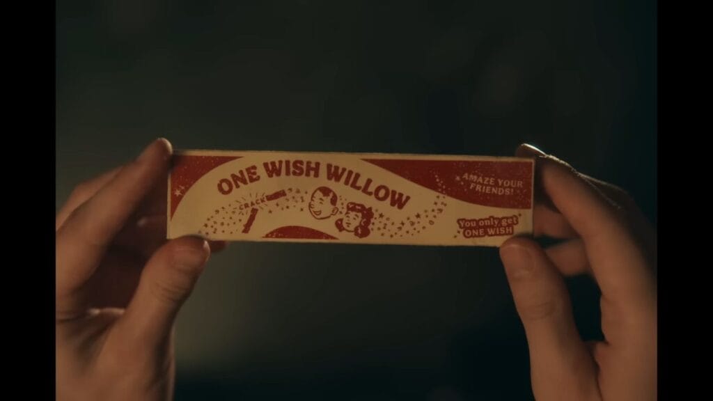 Hands holding a vintage One Wish Willow box with text: Amaze your friends! You only get one wish in the movie Obsession (2025)