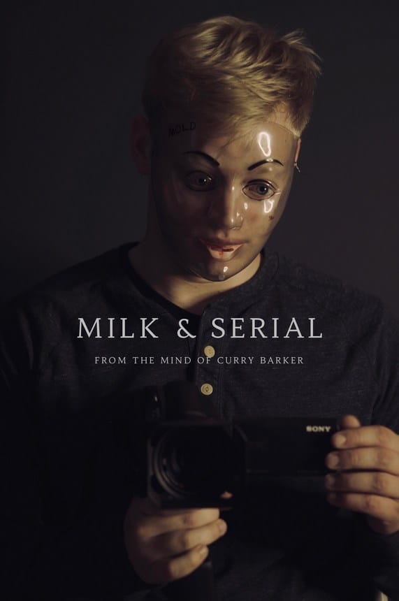 Official title card and promotional poster for the found footage horror movie Milk & Serial, featuring a man wearing a creepy clear plastic doll mask while holding up a Sony handheld camcorder.