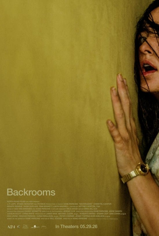 The official theatrical movie poster for the analog horror film Backrooms (2026) showing a close-up profile of a woman with wide eyes pressing her hand against a yellow-walled, liminal space structure.