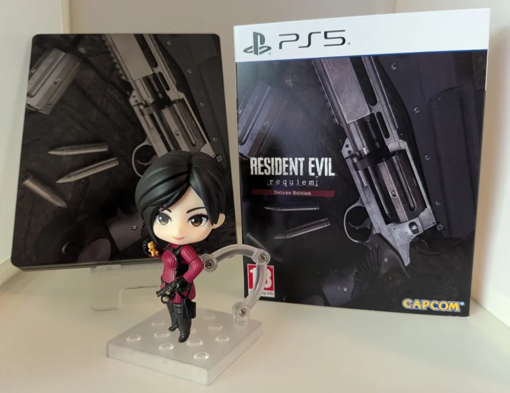 A copy of the PAL PS5 deluxe edition of Resident Evil Requiem shown off by an Ada Wong Nendoroid
