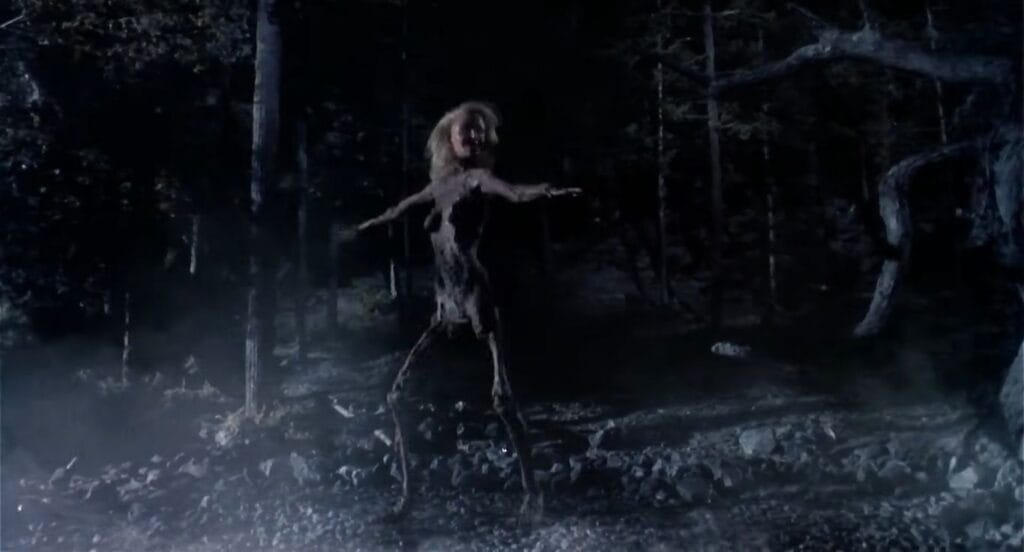 The headless possessed corpse of Linda dancing in the dark, foggy woods at night in Evil Dead II.