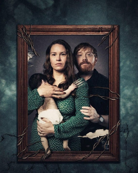 Official movie poster for Nightborn featuring a family portrait in a wooden frame entwined with thorny roots, showing a mother holding a hairy infant beside her husband.