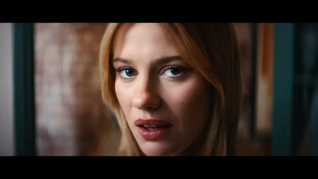 A close-up of Lily Sullivan as Sara staring with an uncanny, intense expression in Soulm8te.