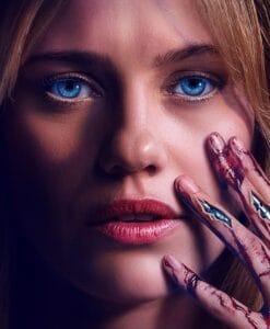 Featured image for the Soulm8te ending explained article showing a close-up of Lily Sullivan with blue eyes and a bloody mechanical hand.