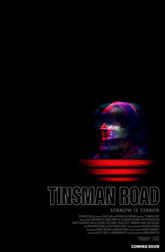 Official movie poster for Tinsman Road featuring a distorted, colourful silhouette of a face against a black background with the tagline Sorrow is Terror.