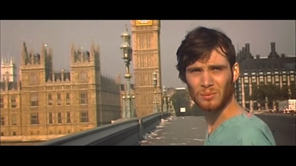 Close-up shot from the 1080p trailer of Jim (Cillian Murphy) looking bewildered on a deserted Westminster Bridge with the Houses of Parliament and Big Ben behind him.