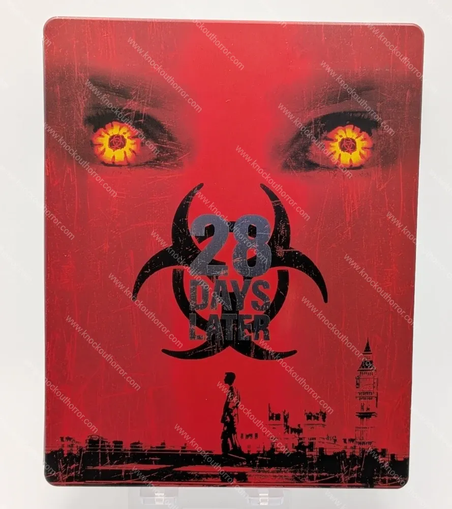 Front cover artwork of the 28 Days Later 4K steelbook case featuring a blood-red backdrop, glowing infected eyes, and the London skyline silhouette.