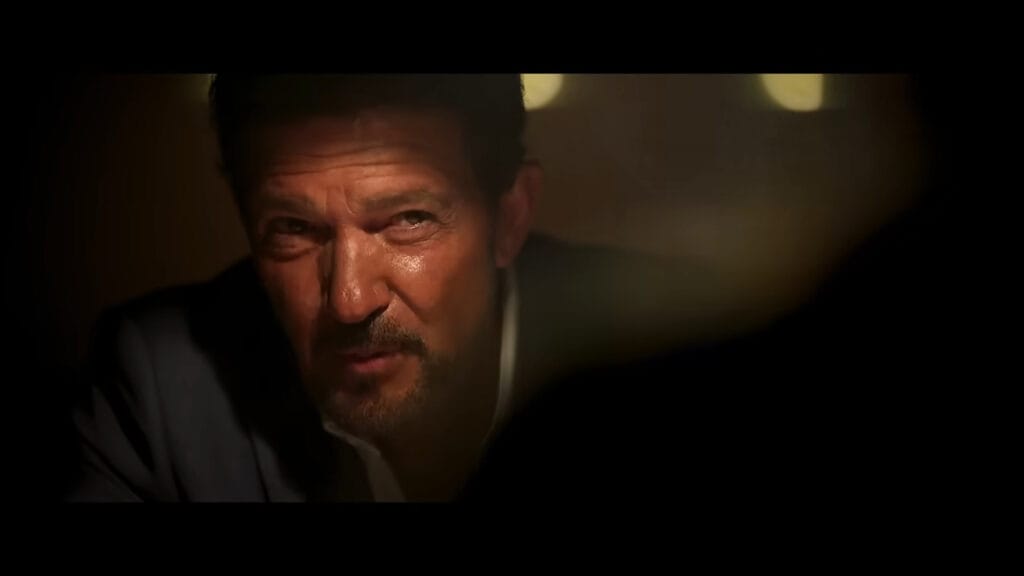 Antonio Banderas looking intense and weary in warm, dim lighting in Above and Below.