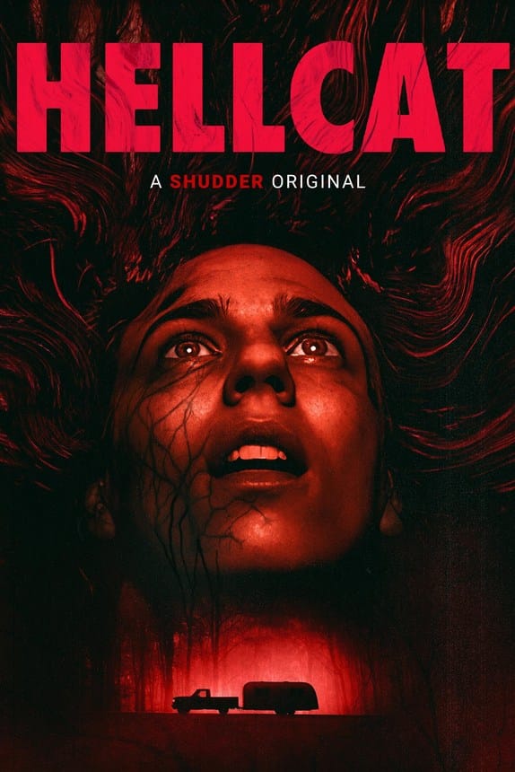Official movie poster for Hellcat featuring a woman's terrified red-lit face looking up above a truck towing a trailer on a dark road.