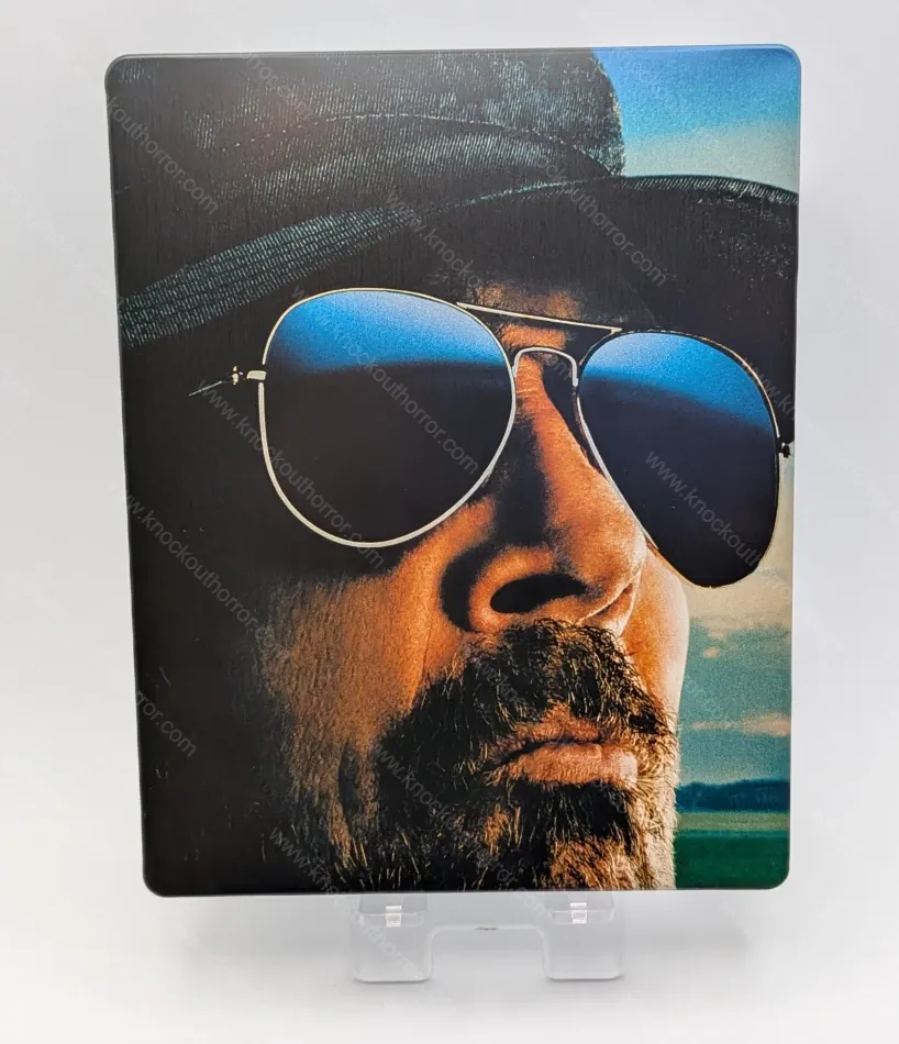 Front artwork of The Long Walk 4K steelbook case without slipcover, showing a close-up of The Major wearing aviator sunglasses reflecting a clear blue horizon.