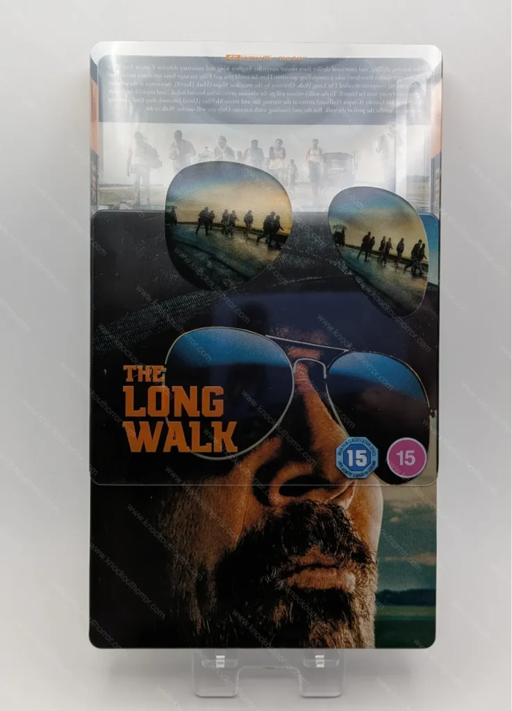 The Long Walk steelbook with the printed transparent slipcover partially slid off to show the lens overlay alignment effect.