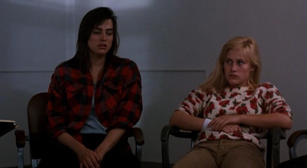Jennifer and Kristen sitting side by side looking sullen and withdrawn during group therapy in A Nightmare on Elm Street 3: Dream Warriors.