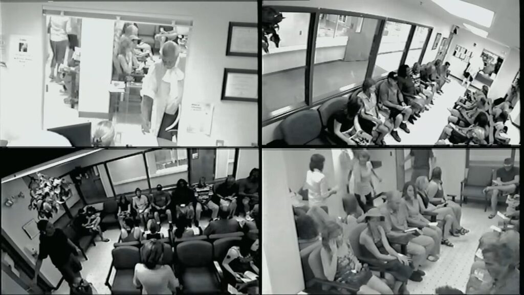 A four-panel security camera view showing crowded hospital waiting rooms in The Bay.