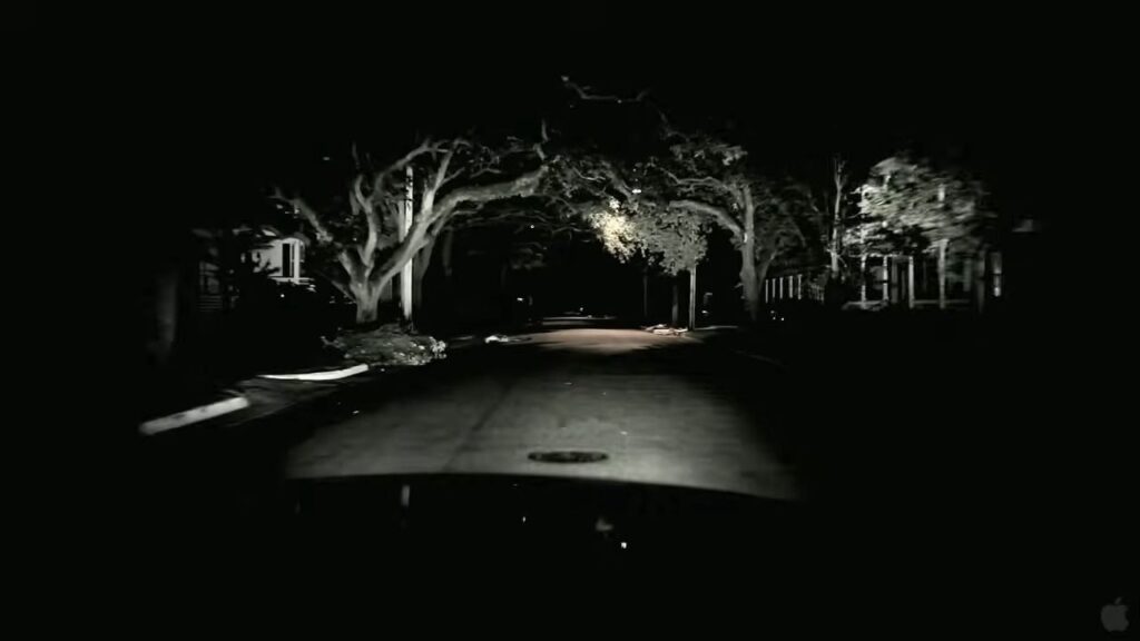A police cruiser dashboard camera view driving down an empty, dark suburban street at night in The Bay.