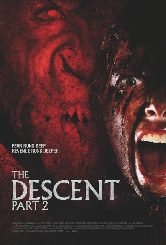 Official movie poster for The Descent: Part 2 featuring a blood-smeared woman screaming next to the snarling face of a cave crawler.