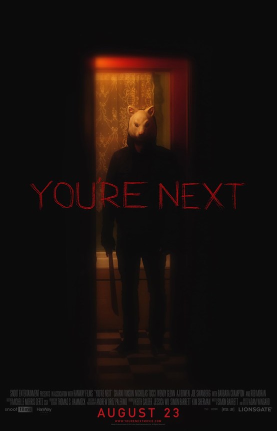 Official movie poster for You're Next showing a killer in a lamb mask holding a machete in a doorway beneath red title text.